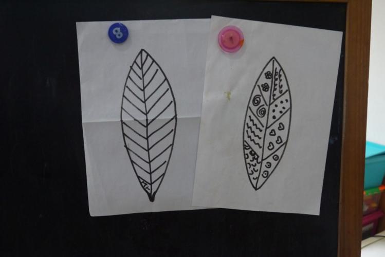 然后画一个和真实叶脉完全不同的造型,涂上你喜欢的颜色,一片有着奇特