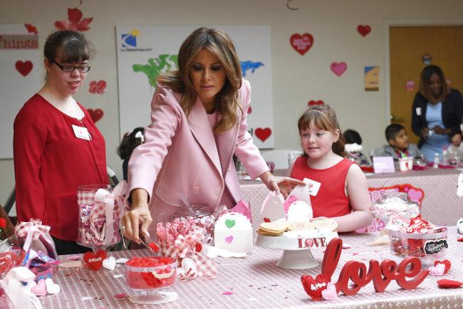 first lady makes valentine"s day art with pediatric patients