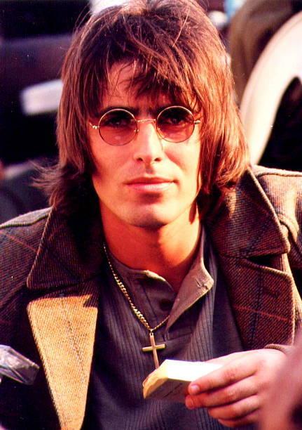 liam gallagher of oasis sits in the crowd before