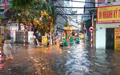 torrential rain floods several hanoi streets