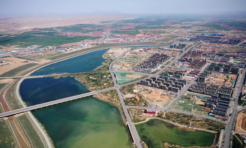 宁夏吴忠市同心县,清水河水系环绕下的县城(无人机照片,6月22日摄).