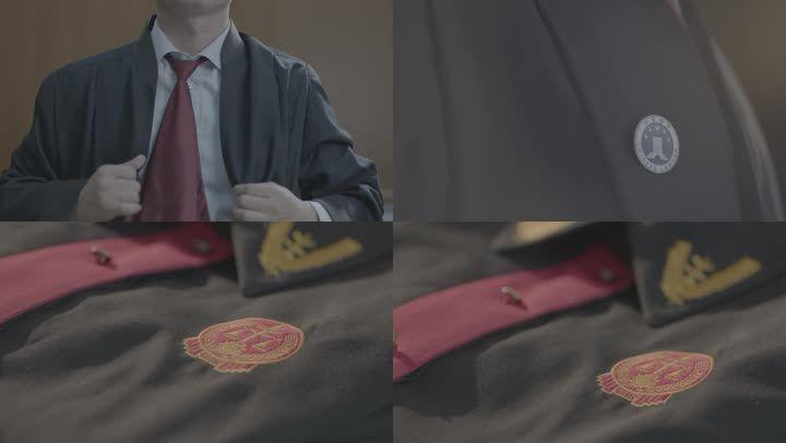 穿律师服手摸法袍