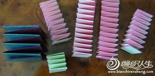 手工折纸弹簧傀儡娃娃的教程