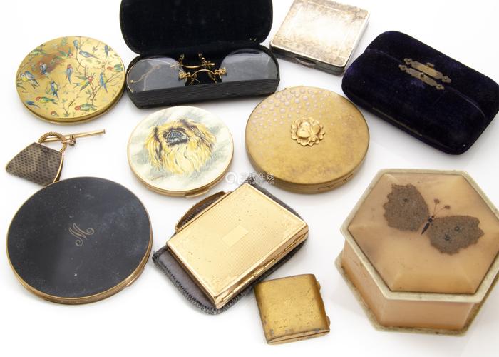 s compacts, including one with a painted top depicting pekinese