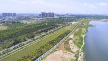 草滩生态产业园:草滩生态产业园地处渭河南岸,紧邻西安铁路北客站和