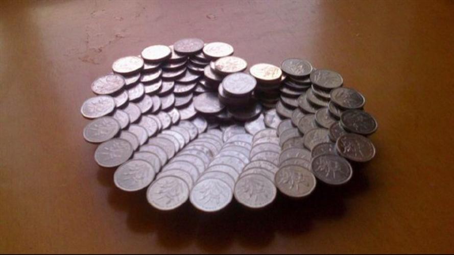 我想用硬币拼成一个立体的心,可是不知道怎么开始,有谁会的麻烦给说一