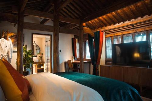 【黄山墟里樵歌民宿】地址:西溪南镇西溪南村十字街23