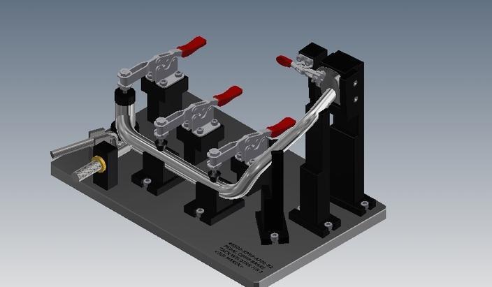 焊接夹具是为保证焊件尺寸大小,提高装配精度和效率,防止焊接变形所