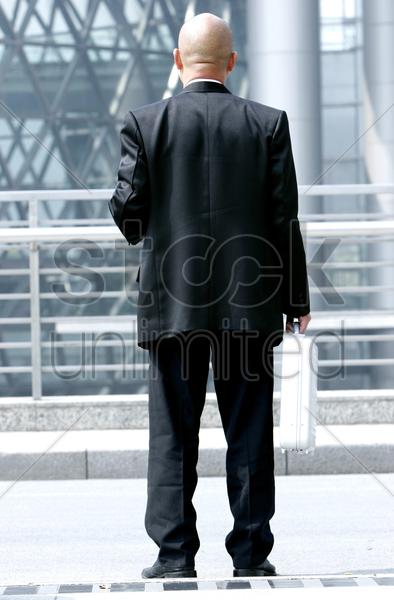 热门: back shot of a bald man in business sui